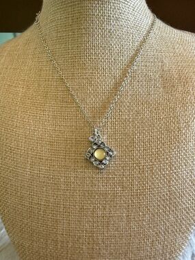 Silver Pendant Necklace with Yellow Center
